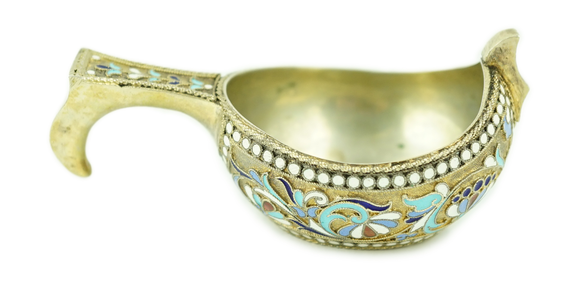 A late 19th/early 20th century Russian 84 zolotnik silver gilt and polychrome enamelled kovsh